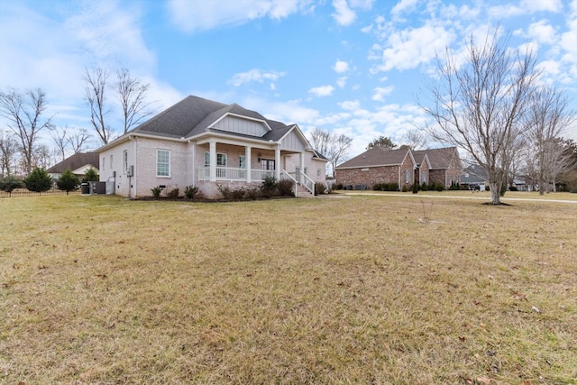 view of front of house with a porch and a front yard