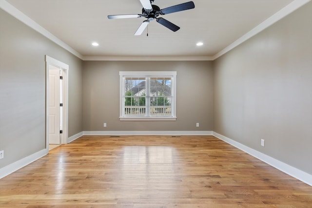 empty room with ceiling fan, ornamental molding, and light hardwood / wood-style flooring