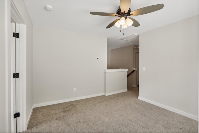 carpeted empty room with ceiling fan