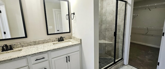 bathroom with vanity and an enclosed shower