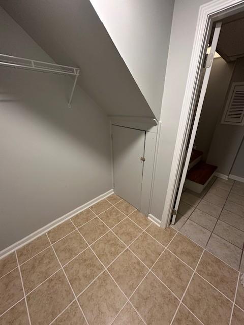 washroom with light tile patterned floors