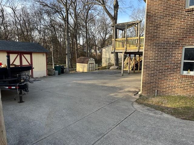 view of patio / terrace with a shed