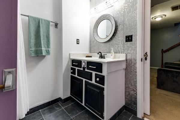 bathroom with tile patterned floors and vanity