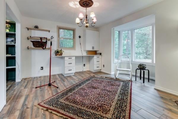 bathroom featuring an inviting chandelier and hardwood / wood-style floors