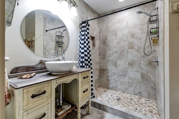 bathroom featuring vanity and walk in shower