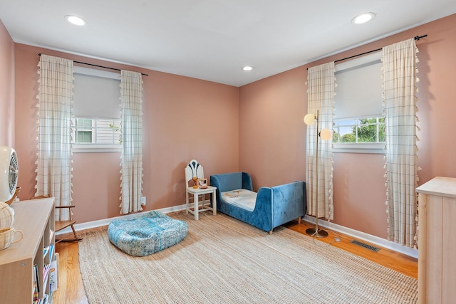 sitting room with hardwood / wood-style flooring