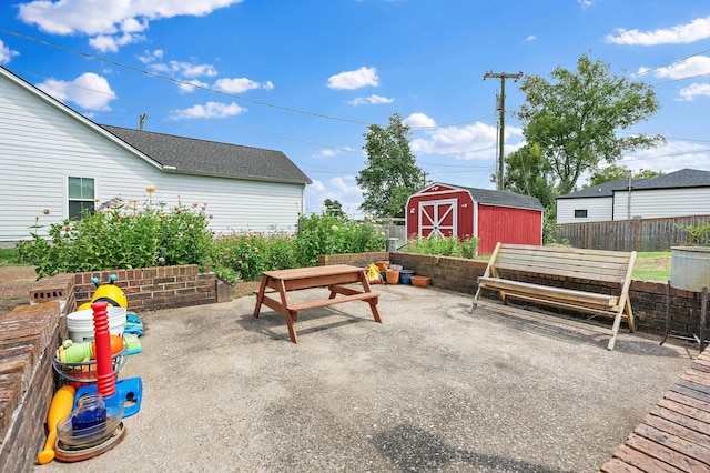 view of patio / terrace with a storage shed