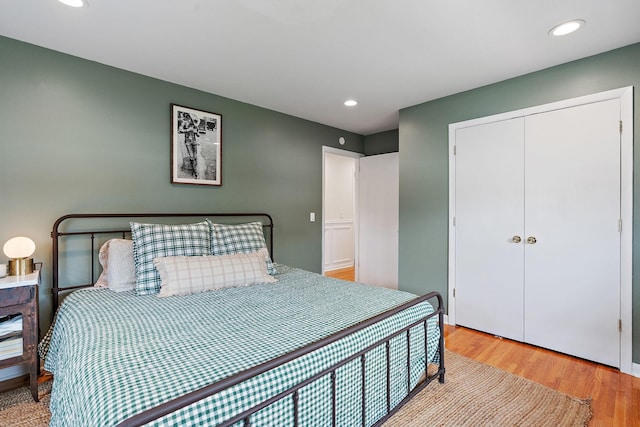 bedroom featuring light hardwood / wood-style floors and a closet