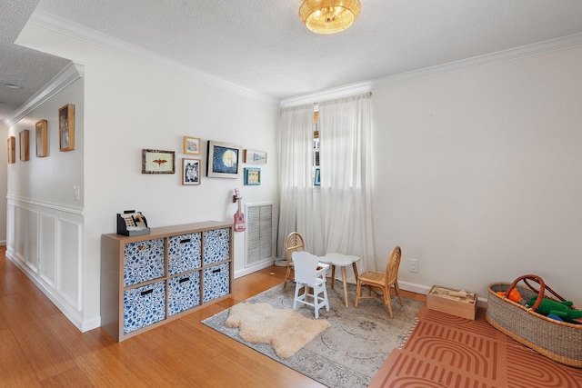 interior space featuring wood-type flooring and crown molding