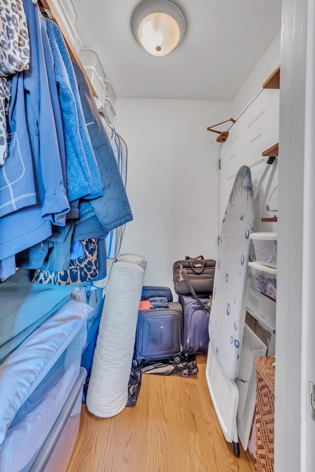 walk in closet featuring hardwood / wood-style floors