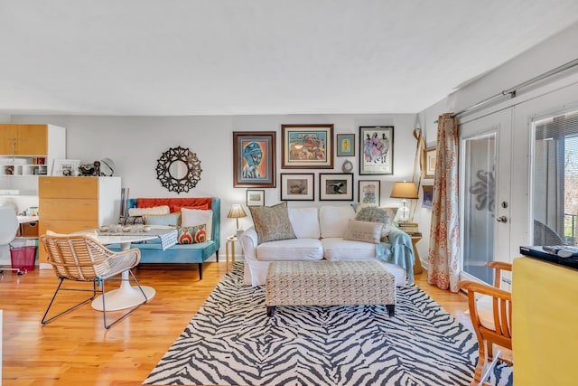 living room featuring light hardwood / wood-style flooring and french doors