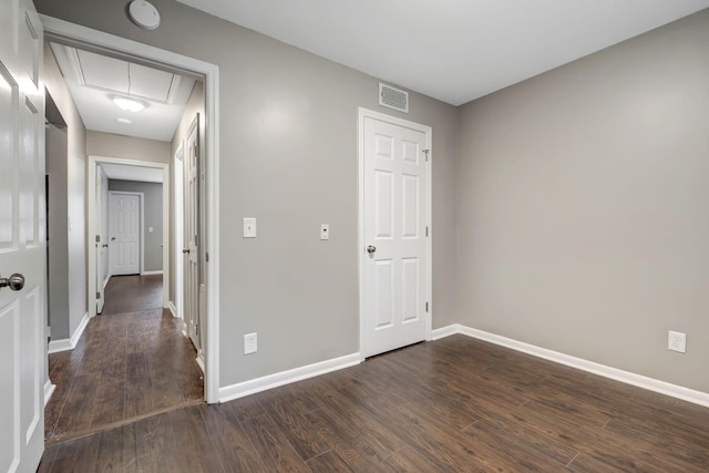 unfurnished room featuring dark hardwood / wood-style floors