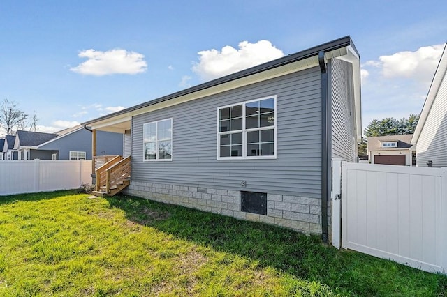 back of house with a yard