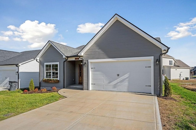 single story home with a garage and a front yard