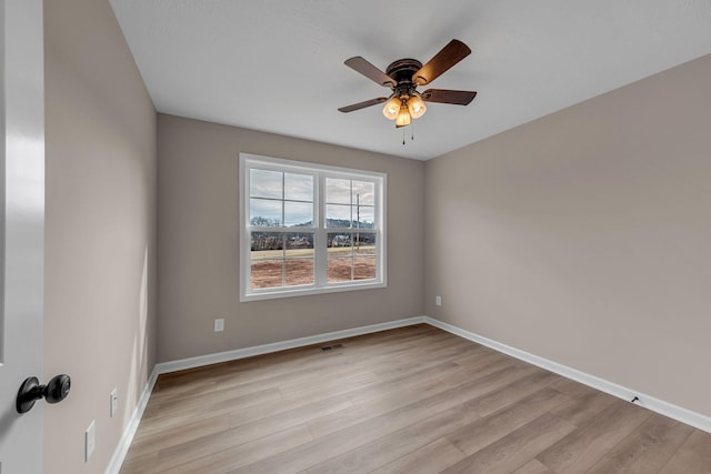 unfurnished room with ceiling fan and light wood-type flooring