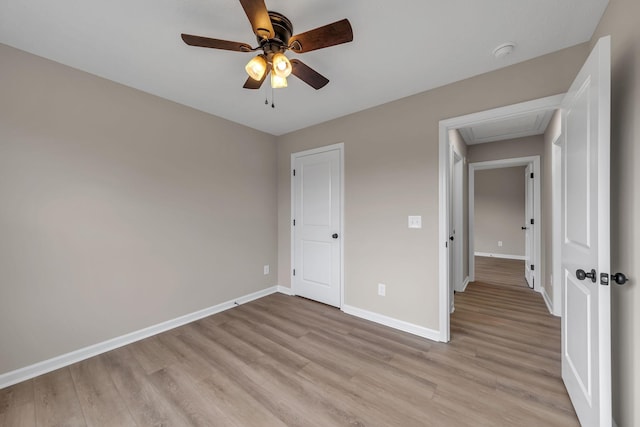 unfurnished bedroom featuring ceiling fan and light hardwood / wood-style flooring