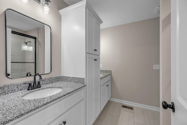 bathroom featuring vanity and walk in shower