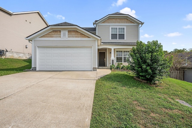 view of front facade with a garage and a front yard