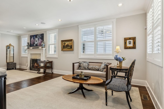 living room with crown molding and dark hardwood / wood-style floors