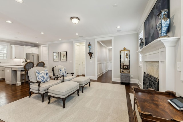 living room with crown molding and dark hardwood / wood-style floors