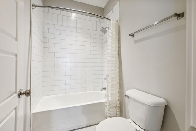 bathroom featuring toilet and shower / bath combo with shower curtain