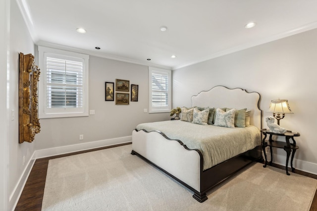 bedroom featuring crown molding and hardwood / wood-style flooring