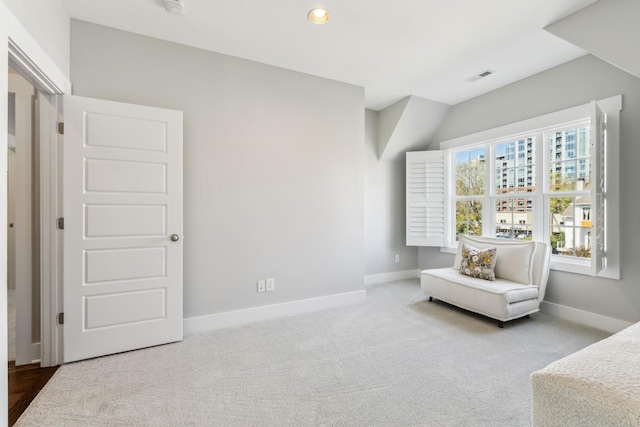 sitting room with carpet floors