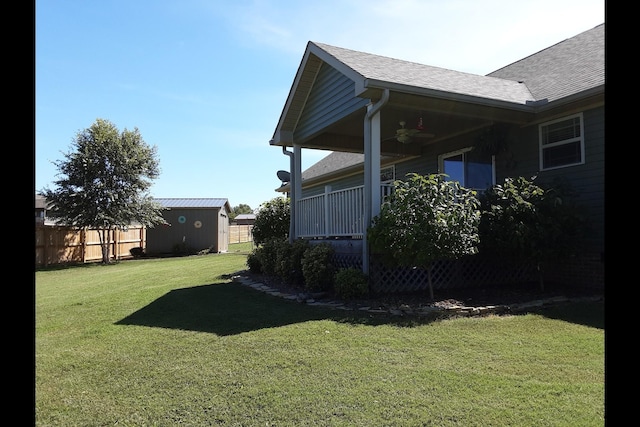 view of yard with a storage unit