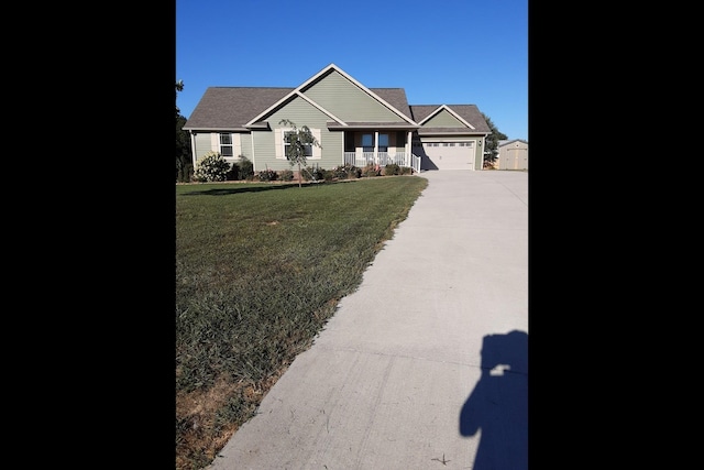 view of front of home featuring a garage and a front yard