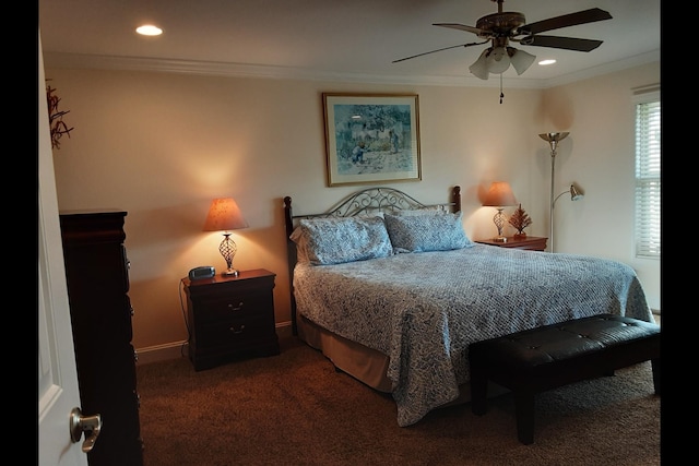 carpeted bedroom with crown molding and ceiling fan