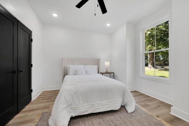 bedroom featuring ceiling fan and light wood-type flooring