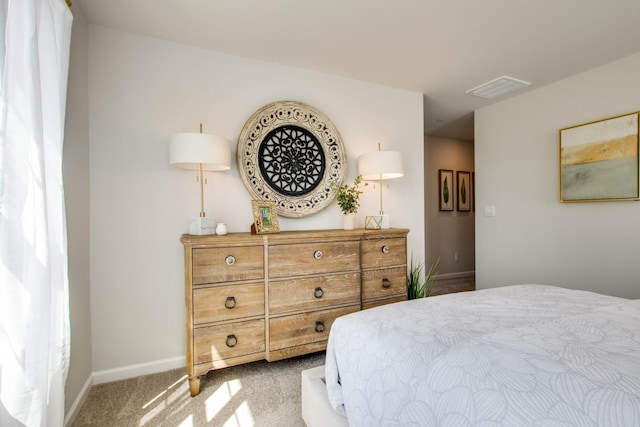 bedroom with light colored carpet