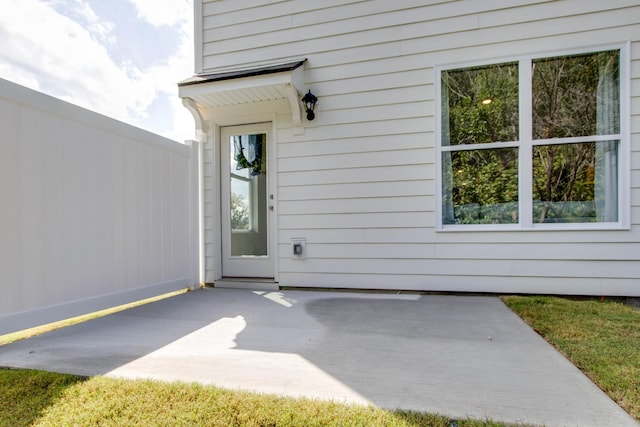 property entrance with a patio