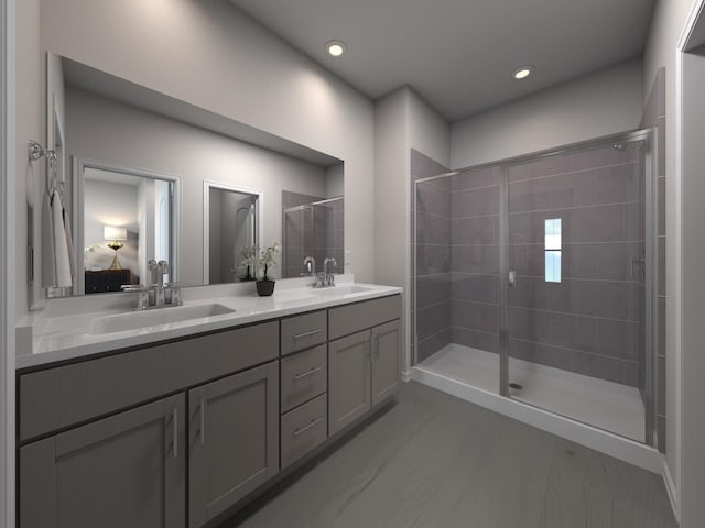 bathroom with vanity and a shower with shower door