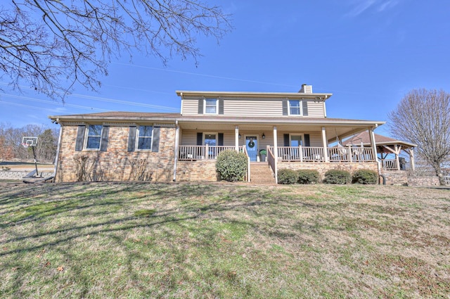 view of front of property with a porch and a front yard