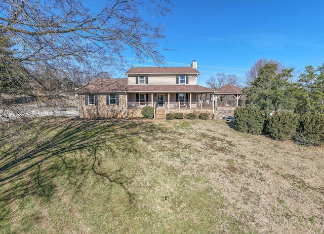 view of front of house with a front yard and a porch