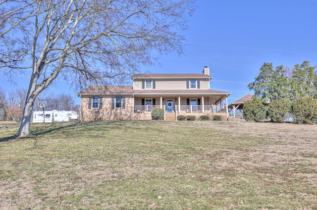 view of front facade with covered porch and a front yard