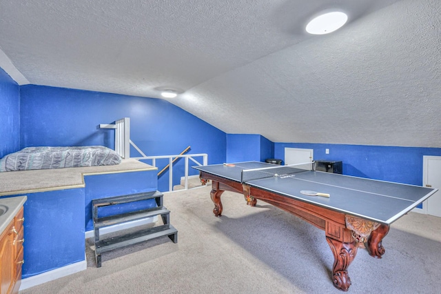 playroom with vaulted ceiling, a textured ceiling, and carpet