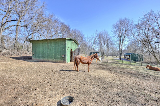 view of outdoor structure with a rural view