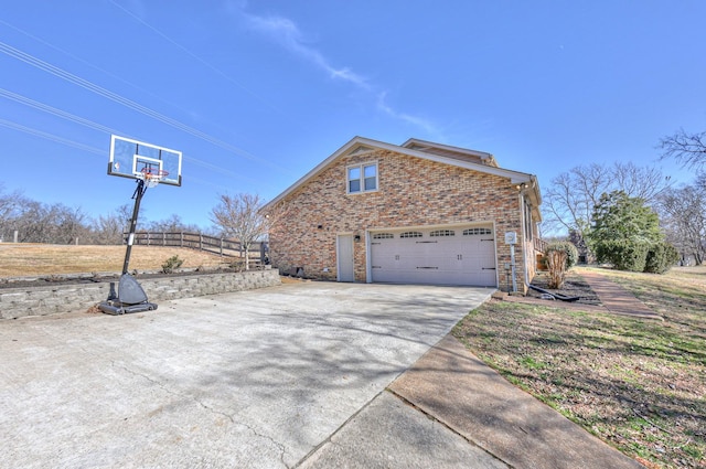 view of property exterior featuring a garage