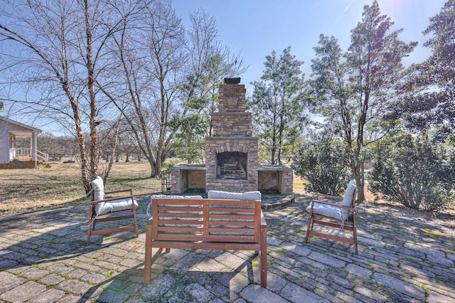 view of patio / terrace featuring an outdoor living space with a fireplace