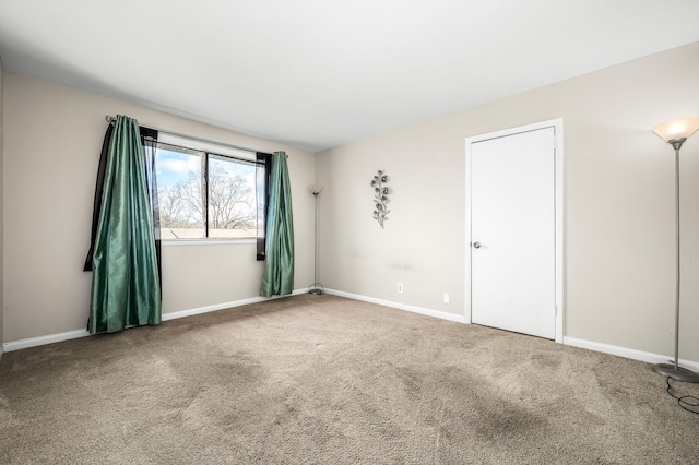 unfurnished room with carpet floors