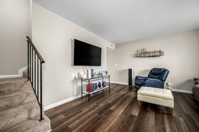 living area with dark hardwood / wood-style floors