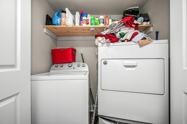 washroom featuring washer and clothes dryer