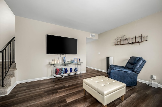 living room featuring dark hardwood / wood-style flooring