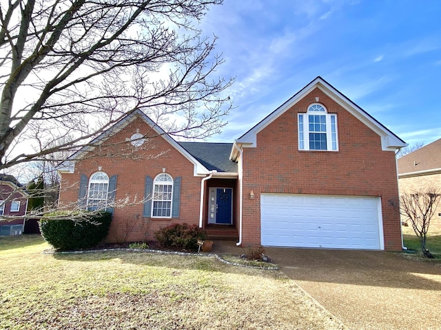 traditional home featuring a garage, concrete driveway, brick siding, and a front lawn