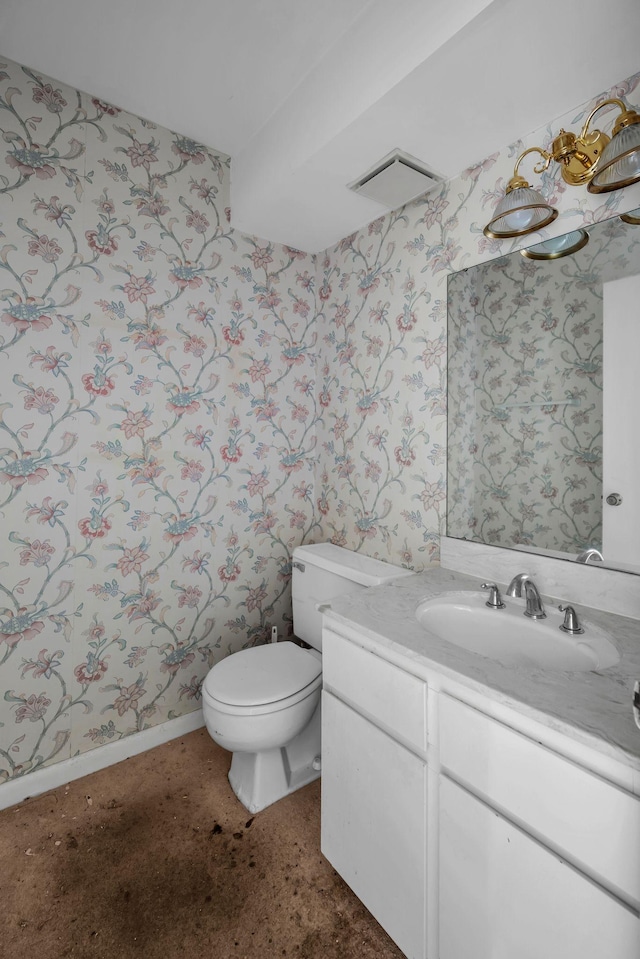 bathroom featuring vanity and toilet