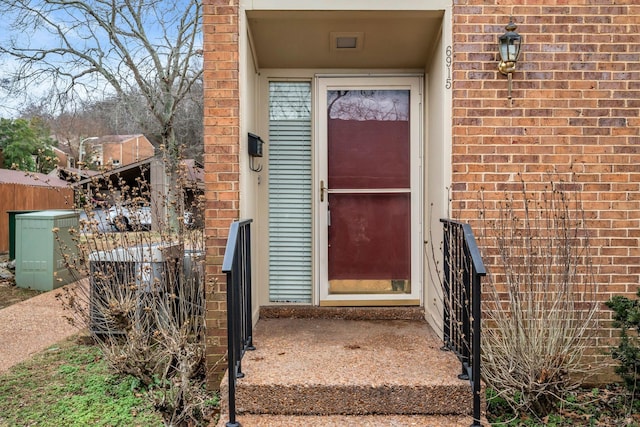 doorway to property featuring central AC unit