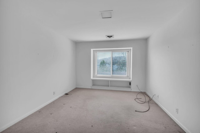 spare room with light colored carpet