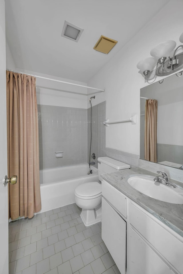 full bathroom featuring tile patterned flooring, vanity, shower / bath combination with curtain, and toilet